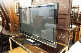 A 42" PANASONIC FLAT SCREEN TV (LACKS LEAD)