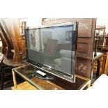 A 42" PANASONIC FLAT SCREEN TV (LACKS LEAD)