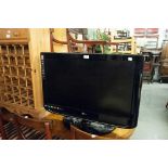 A 32" LG FLAT SCREEN TV (LACKS LEAD)