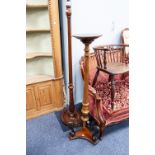 EARLY TWENTIETH CENTURY CARVED MAHOGANY TORCHERE, with part fluted column, the tripod support with