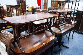 TWO SIMILAR MODERN REPRODUCTION MAHOGANY COFFEE TABLES WITH CROSSBANDED TOPS AND LYRE SHAPED END