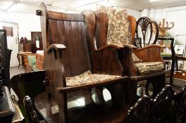 A PAIR OF SOLID OAK ARMCHAIRS