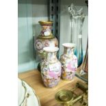 A CLOISONNE VASE WITH FLORAL DECORATION ON WOODEN STAND AND TWO SIMILAR PORCELAIN EXAMPLES (3)