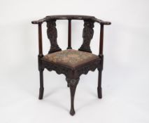 GEORGE III CARVED MAHOGANY CORNER CHAIR, of typical form, the flat top rail and splats carved with