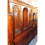 A MODERN REPRODUCTION MAHOGANY DISPLAY CABINET, THE UPPER PORTION WITH ENCLOSED GLASS SHELVED
