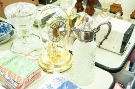 A CUT GLASS CLARET JUG WITH ELECTROPLATED TOP AND AN ANNIVERSARY CLOCK (2)