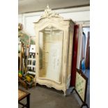 A LARGE FRENCH STYLE CREAM PAINTED DISPLAY CABINET WITH GLASS SHELVES AND LARGE GLAZED DOOR, WITH