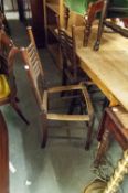 A SET OF OF FOUR ARTS AND CRAFTS STYLE SINGLE CHAIRS WITH WAVY LADDER RAIL BACKS (LACKS SEATS)