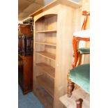 A HARDWOOD ARTS AND CRAFTS STYLE OPEN BOOKCASE OF SIX TIERS WITH FIXED SHELVES, 3'6" WIDE