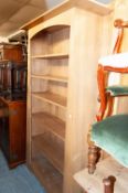 A HARDWOOD ARTS AND CRAFTS STYLE OPEN BOOKCASE OF SIX TIERS WITH FIXED SHELVES, 3'6" WIDE