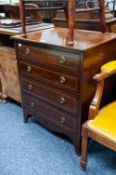 EARLY NINETEENTH CENTURY CONTINENTAL LINE INLAID MAHOGANY SMALL CHEST OF FOUR DRAWER, outlined in