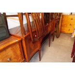 AN EDWARDIAN INLAID MAHOGANY SERPENTINE FRONT SIDEBOARD, TWO CUPBOARDS FLANKING ONE LARGE CENTRAL