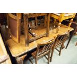 A MAHOGANY OBLONG DINING TABLE, ON CABRIOLE SUPPORTS WITH CLAW AND BALL FEET AND CASTORS,