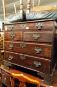 A SMALL GEORGIAN MAHOGANY CHEST OF OROLO MOULDED DRAWERS ON REPLACED BRACKET FEET