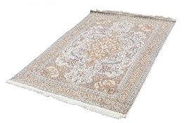 EASTERN SILKY PILE RUG, with pink and floral centre medallion with pendants on a white field wit