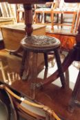 AN EARLY TWENTIETH CENTURY OAK RUSH SEAT STOOL, ANOTHER FOUR LEGGED CIRCULAR STOOL WITH CARVED