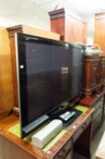 PANASONIC 50" FLAT SCREEN TV. AND A PANASONIC HOME AND THEATRE SYSTEM
