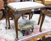 NINETEENTH CENTURY CARVED AND EBONISED CIRCULAR FOOTSTOOL, heightened in gilt, and A STAINED BEECH