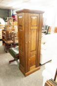 A DISGUISED OAK GUN CABINET, WITH GREEN BAIZE LINING TO ACCOMMODATE SEVEN SHOTGUNS