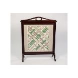 AN OAK FRAMED FIRESCREEN WITH INSET TAPESTRY PANEL