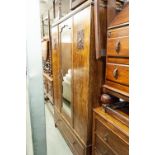 AN OAK BEDROOM SUITE OF THREE PIECES, VIZ A WARDROBE WITH MIRROR DOOR AND DRAWER BELOW, WITH BLIND