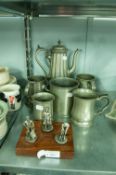 A LATE VICTORIAN BRITANNIA METAL COFFEE POT AND FIVE OTHER PIECES OF HAMMERED PEWTER VARIOUS