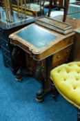 VICTORIAN CARVED WALNUT DAVENPORT DESK, of typical form with bombe shaped stationary compartment,