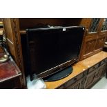 MODERN SAMSUNG FLAT SCREEN TELEVISION WITH REMOTE CONTROL AND POWER LEAD