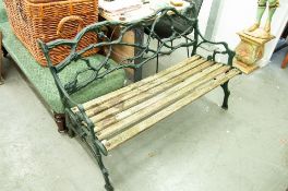 A GREEN PAINTED CAST IRON ENTWINED BRANCH PATTERN AND SLATTED WOOD GARDEN BENCH