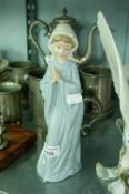 A MODERN NAO PORCELAIN MODEL OF A YOUNG GIRL IN PRAYER