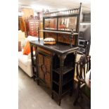 AN ARTS AND CRAFTS EBONISED DECORATED SIDE CABINET, WITH RAISED MIRROR BACK