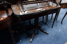 REGENCY MAHOGANY PEDESTAL FOLD-OVER TEA TABLE, with D shaped top, heavy ring turned column and