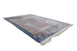 WASHED CHINESE SMALL CARPET with plain mushroom field, the pale green border having plain narrow