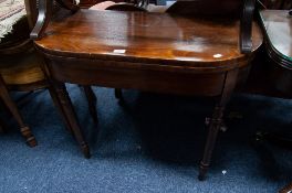 GEORGIAN FIGURED MAHOGANY FOLD-OVER TEA TABLE, with D shaped top and turned legs