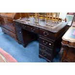 MODERN REPRODUCTION DARK OAK TWIN PEDESTAL DESK, with gilt tooled 'antique' brown leather inset top,