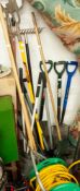 A COLLECTION OF GARDEN TOOLS TO INCLUDE RAKES, FORKS, SPADES ETC...