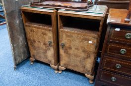 PAIR OF BURR WALNUT BEDSIDE CABINETS each with rounded oblong top above an open shelf and cupboard