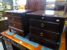 A STAG MAHOGANY HEADBOARD, AND A PAIR OF STAG MAHOGANY BEDSIDE PEDESTALS WITH TWO DRAWERS AND SLIDE