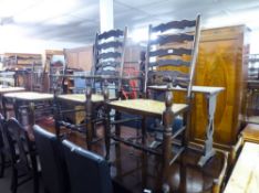 A PAIR OF REPRODUCTION OAK DINING CHAIRS, HAVING LADDER BACKS WITH RUSH SEATS AND A PAIR OF HARDWOOD