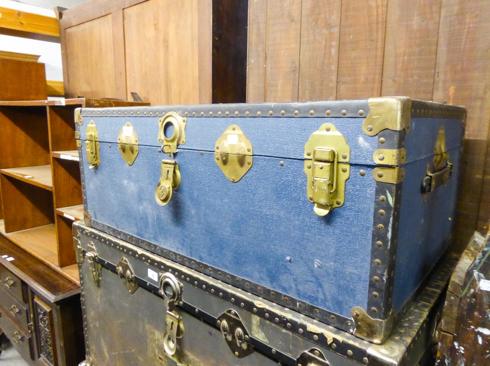 A SMALLER FIBRE AND METAL BOUND CABIN TRUNK