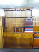 AN ELM WELSH DRESSER WITH RAISED PLATE RACK