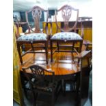 A REPRODUCTION MAHOGANY EXTENDING 'D' END DINING TABLE HAVING FLUTED LEGS AND A SET OF SIX