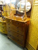 A BOW FRONTED TALL DRESSING TABLE WITH TWO SHORT OVER FOUR LONG GRADUATED DRAWERS