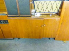 A TEAK CLOSE-AWAY DESK WITH FITTED INTERIOR, WITH TWO DOOR FRONT