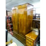 AN EDWARDIAN INLAID MAHOGANY TWO DOOR WARDROBE WITH BASAL DRAWERS