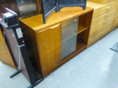 A TEAK DWARF BOOKCASE WITH CUPBOARD AND GLASS SLIDING DOORS AND A TEAK DRINKS CABINET/BAR