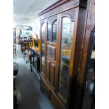 WALNUTWOOD WARDROBE WITH CENTRE CARVED AND GLAZED DOOR FLANKED BY TWO MIRROR DOORS, 4' WIDE