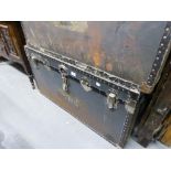 A LARGE FIBRE AND METAL BOUND CABIN TRUNK