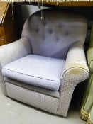 A BUTTON UPHOLSTERED LOUNGE CHAIR