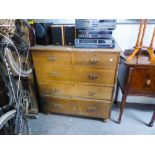 A LATE VICTORIAN OAK CHEST OF DRAWERS